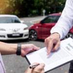 insurance policy paperwork on a clipboard