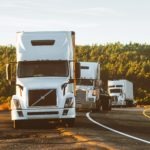 semi trucks pulled off on side of road