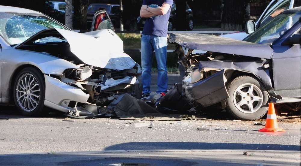 A head-on collision scene. A personal injury attorney in Vero Beach can help you pay for this.