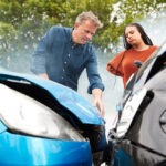 Angry motorists arguing over a fender bender.