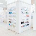 Empty drugstore chemist`s shop pharmacy without staff clients customers visitors with remedies, pills, medicines, goods, painkillers, jars on shelves.